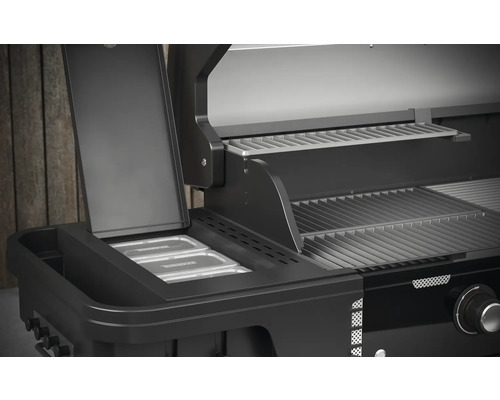 Vue détaillée d''un gril à gaz noir avec espace de rangement et grille.