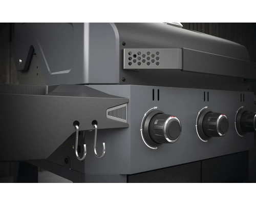 Gros plan d''un gril à gaz avec boutons de commande et crochets