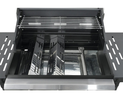 Innenansicht eines Gasgrills mit Grillrost und Brennerabdeckungen