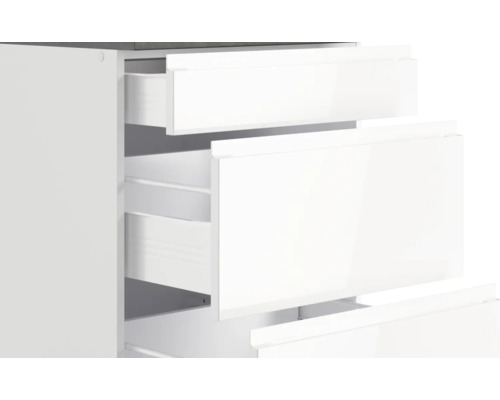 Meuble à tiroirs blanc avec tiroirs ouverts