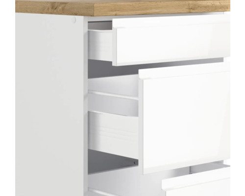 Commode avec tiroirs blancs ouverts et plateau en bois