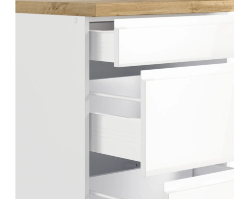 Gros plan d''un meuble à tiroirs blanc avec plateau en bois et tiroirs ouverts