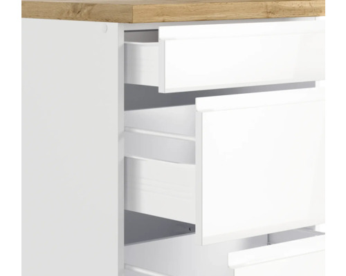 Commode avec tiroirs blancs ouverts et dessus en bois