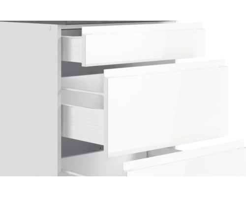 Meuble à tiroirs blanc avec tiroirs ouverts