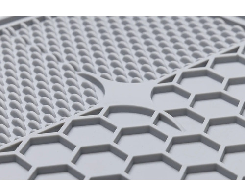 Gros plan d''un dessous de plat en silicone avec différents motifs