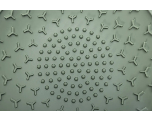 Gros plan d''un tapis de douche avec picots et motif triangulaire