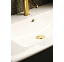 Image d''un lavabo avec robinet et bonde de couleur or