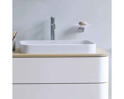 Lavabo avec robinet, porte-savon et meuble sous-lavabo pour la salle de bains.