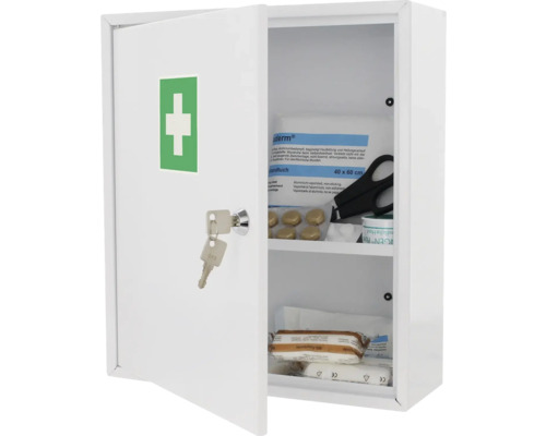 Armoire à pharmacie blanche ouverte avec matériel de premiers secours et clé