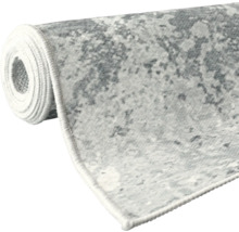Tapis roulé avec motif abstrait