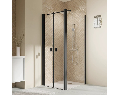 Cabine de douche avec cadre noir et ensemble de douche dans salle de bain