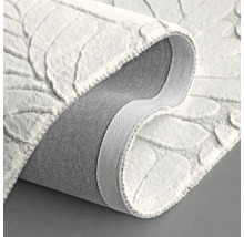 Vue détaillée d''un tapis blanc à motifs de feuilles