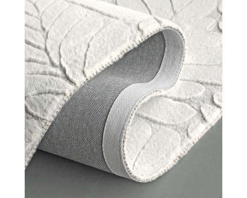 Vue détaillée d''un tapis blanc à motifs de feuilles