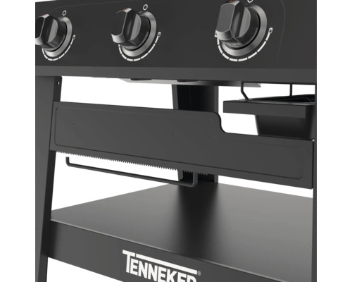 Detailansicht eines schwarzen Gasgrills mit Drehknöpfen, Papierhandtuchhalter und Ablagefläche der Marke Tenneker.