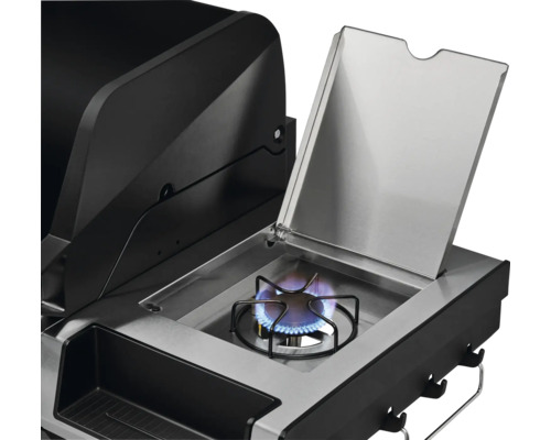 Vue détaillée d''un gril à gaz avec brûleur latéral ouvert