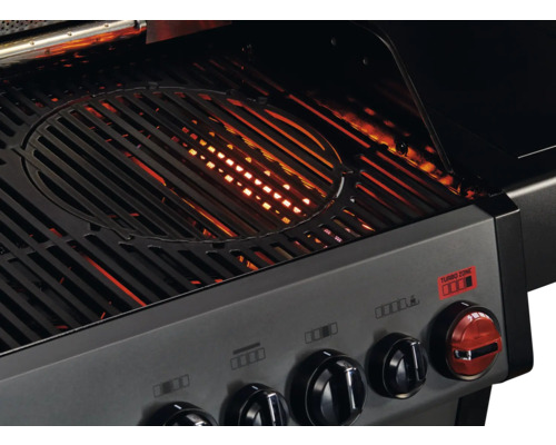 Vue détaillée d''un barbecue avec grille et boutons de commande