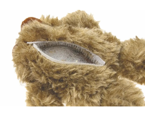 Gros plan d''un ours en peluche avec fermeture éclair et rembourrage
