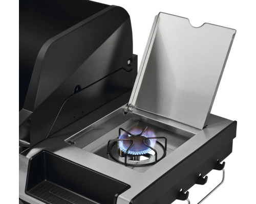 Vue détaillée d''un barbecue à gaz avec brûleur latéral ouvert et flamme bleue