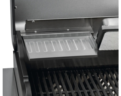 Vue détaillée d''un gril avec une grille de maintien au chaud en acier inoxydable