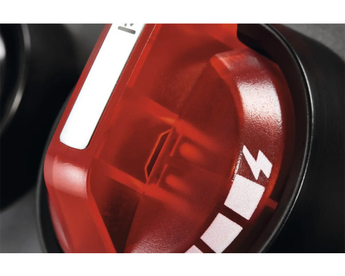 Gros plan d''un bouton de réglage rouge avec un symbole d''éclair