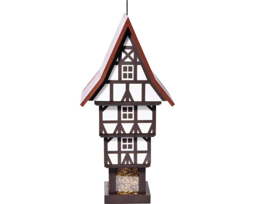 Vogelhaus im Fachwerkhausstil mit Vogelfutter