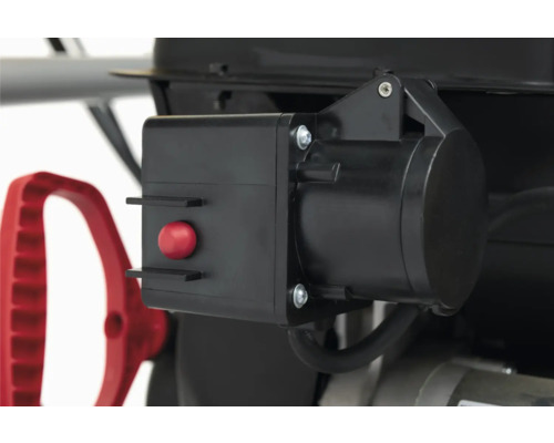 Detailansicht eines schwarzen Schalters mit rotem Knopf an einem Gerät