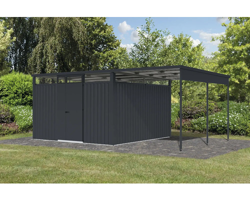 Abri de jardin métallique avec annexe sur une pelouse dans le jardin.