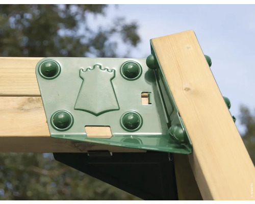 Vue détaillée d''une pièce de raccordement de tour de jeu en métal avec motif de château et bois