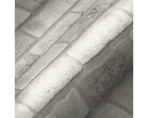 Gros plan d''un rouleau de papier peint avec un motif de briques.