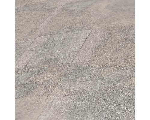 Gros plan de carreaux de sol en vinyle posés avec décor en pierre