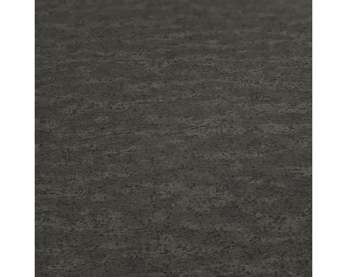 Surface de sol sombre avec une texture rugueuse.