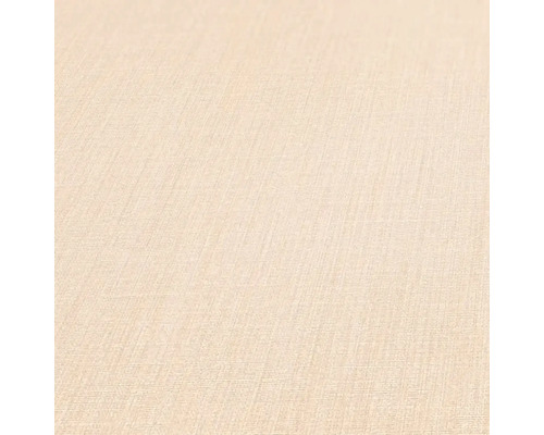 Gros plan d''un papier peint beige avec une texture légère