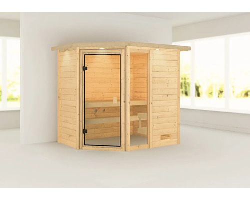 Sauna en bois avec porte en verre dans une pièce lumineuse