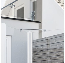 Vue d''un bâtiment avec auvent en verre et garde-corps