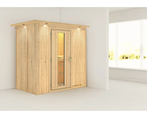 Sauna en bois avec porte en verre et éclairage dans une pièce.