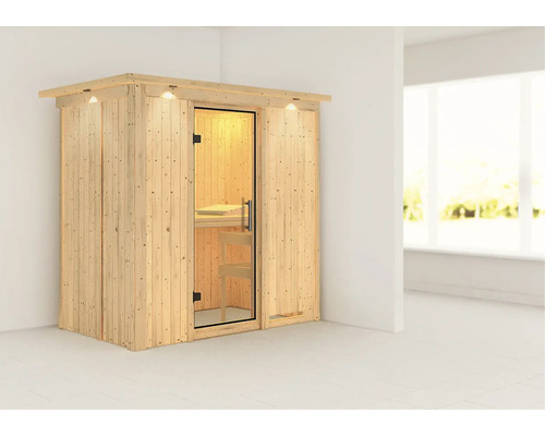 Sauna en bois avec porte vitrée et éclairage intérieur dans la pièce