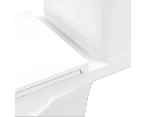 Gros plan de toilettes avec réservoir et couvercle de toilettes