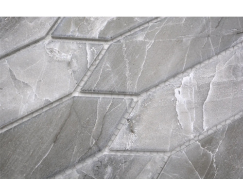 Gros plan d''une mosaïque en marbre gris