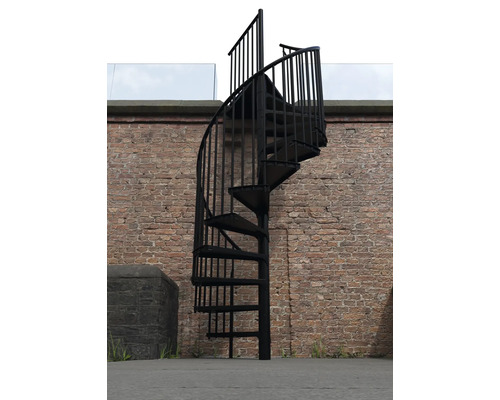 Schwarze Wendeltreppe aus Metall vor einer Ziegelwand