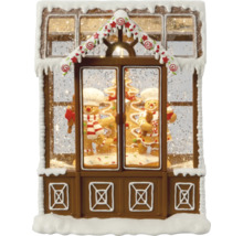 Boule à neige décorative en forme de maison en pain d''épices avec des bonhommes en pain d''épices