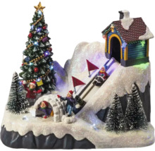 Paysage d''hiver décoratif avec sapin de Noël, igloo, maison et skieurs
