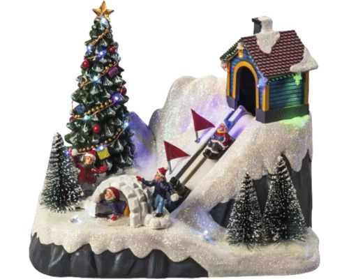 Paysage d''hiver décoratif avec sapin de Noël, igloo, maison et skieurs