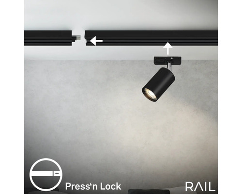 Deckenmontage einer schwarzen Stromschienenschiene mit einem schwarzen LED-Strahler und dem Press''n Lock Symbol.