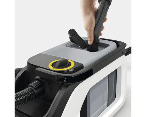 Aspirateur vapeur avec commandes et accessoire en main