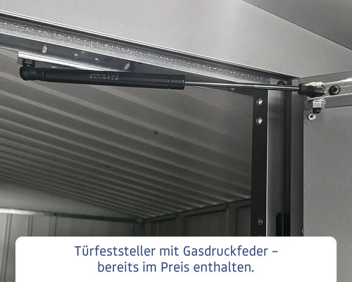 Türfeststeller mit Gasdruckfeder an einem Metallgebäude.