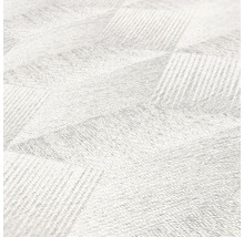 Gros plan d''un tapis blanc avec un motif géométrique