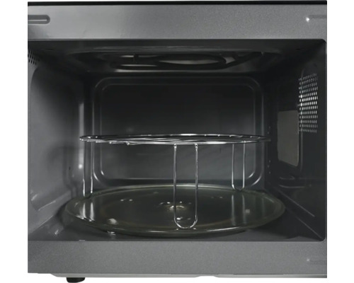 Intérieur d''un micro-ondes avec plateau tournant et grille