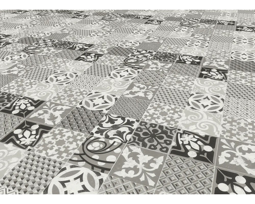 Vue au sol de carreaux avec différents motifs graphiques