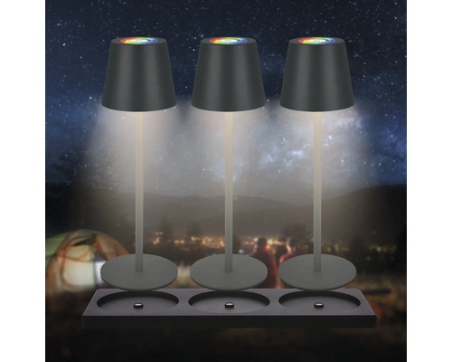 Drei Tischleuchten mit farbwechselndem Lichtschein auf einer Halterung