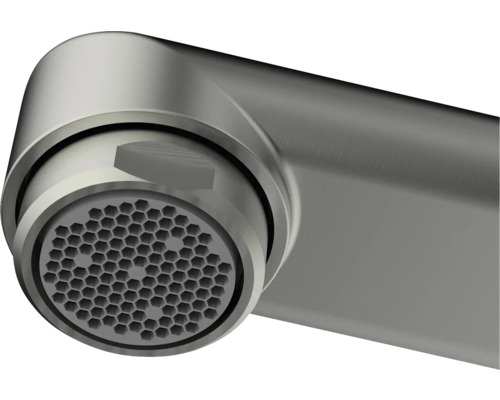 Gros plan d''un bec de robinet avec un motif en nid d''abeilles